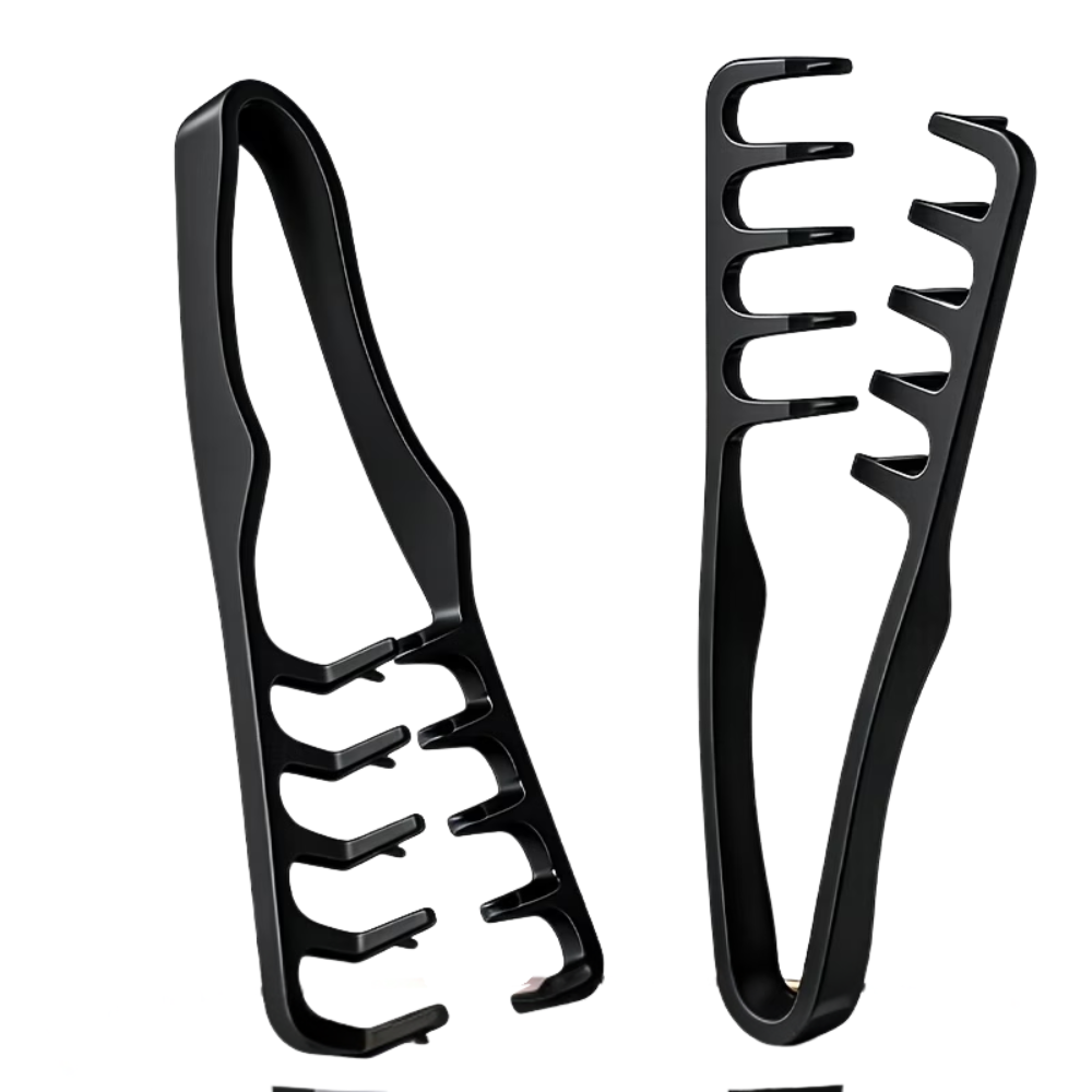Two black hair styling tools on a white background