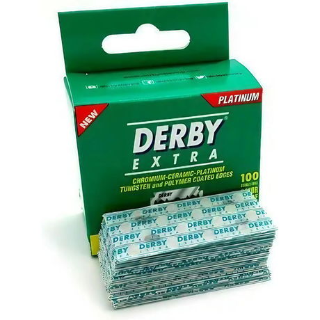 Box of Derby Extra razor blades with a stack of blades on a white background