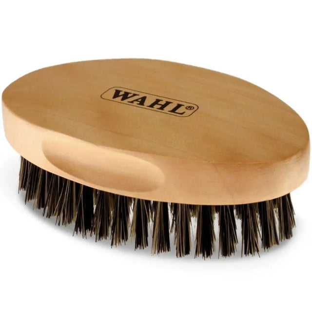 Wooden beard brush with black bristles and 'Wahl' branding on a white background